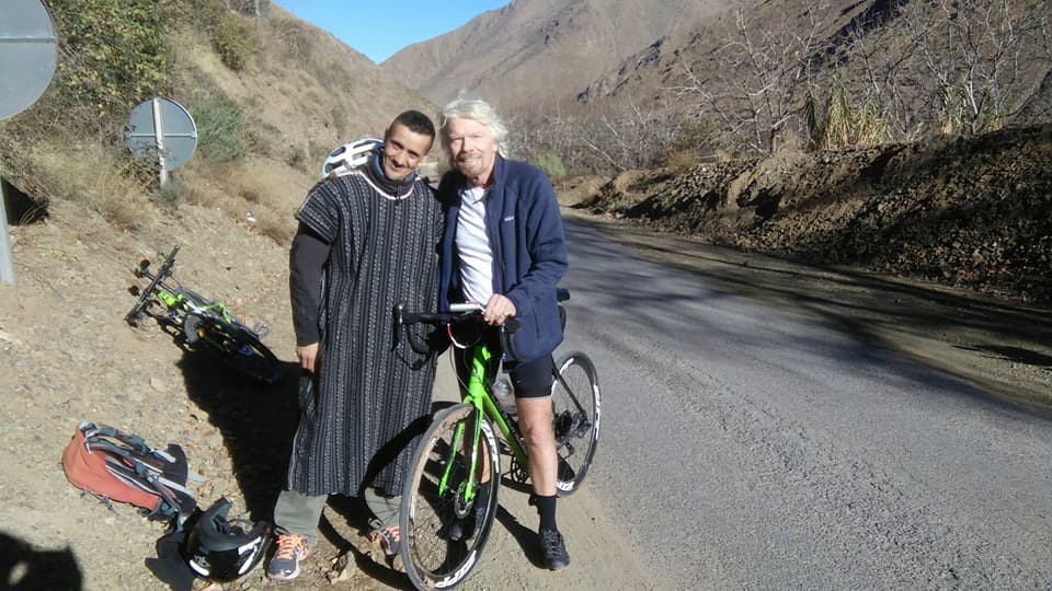 Richard Branson riding bike in Imlil valley Morocco