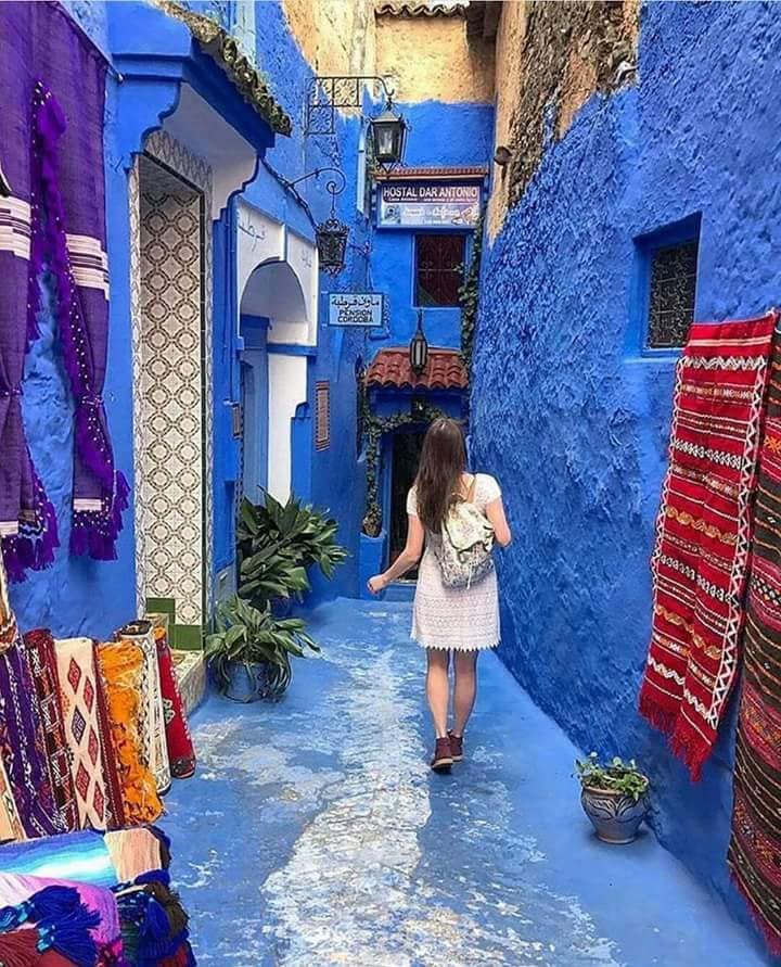 a girl in the street of blue City in Chefchaouen