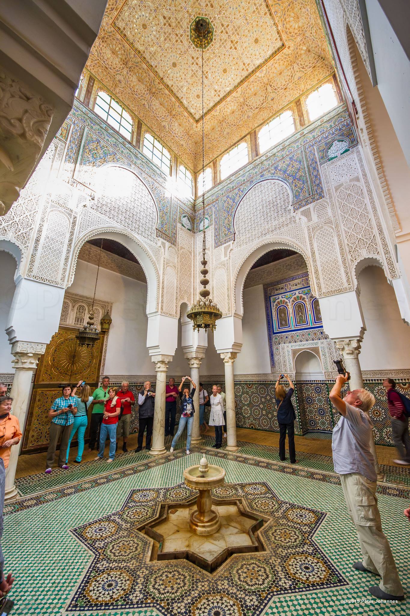 Inside Mausoleum of Moulay Ismail in Meknes with tourists